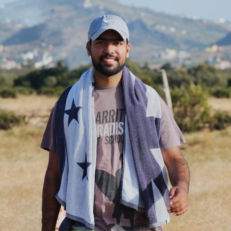Kaveri Mehta, Lead Design Curator at Stem & Story Studio, reviewing corporate floral arrangements